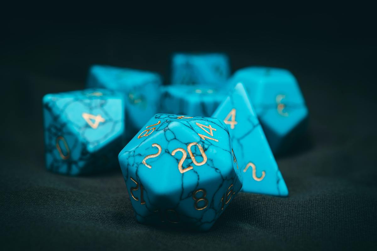 A set of D&D set lay on a table with the D20 facing the camera